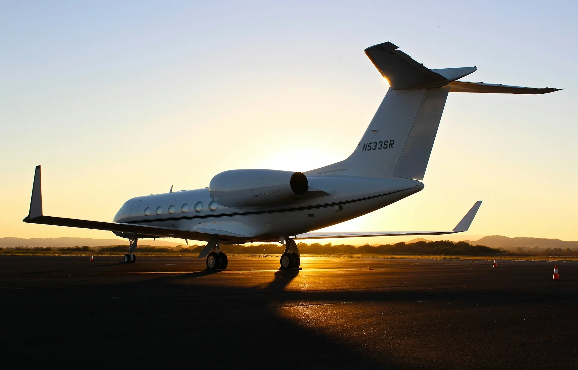 Jet on a runway at sunset