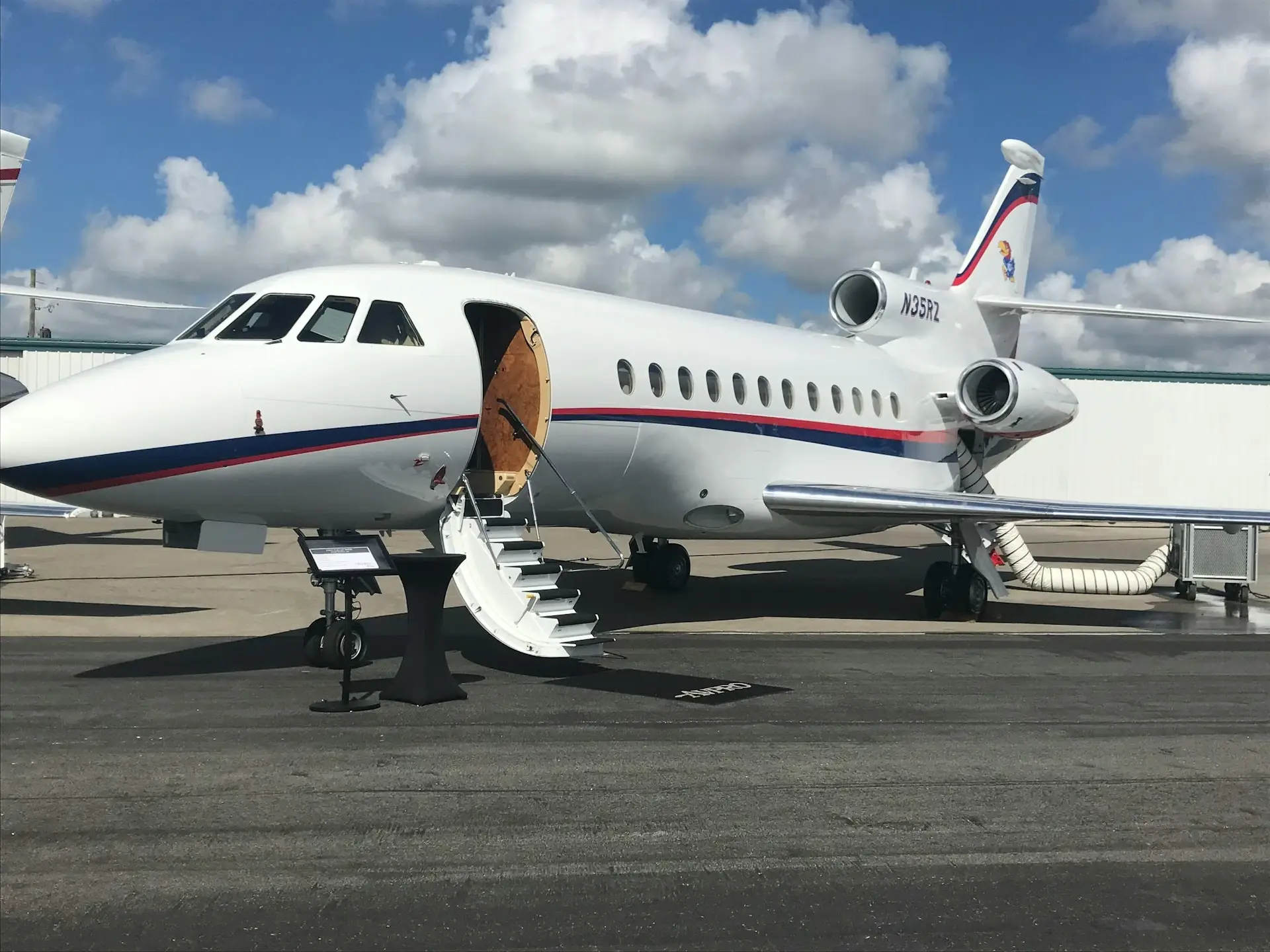 Jet on a runway with its door open